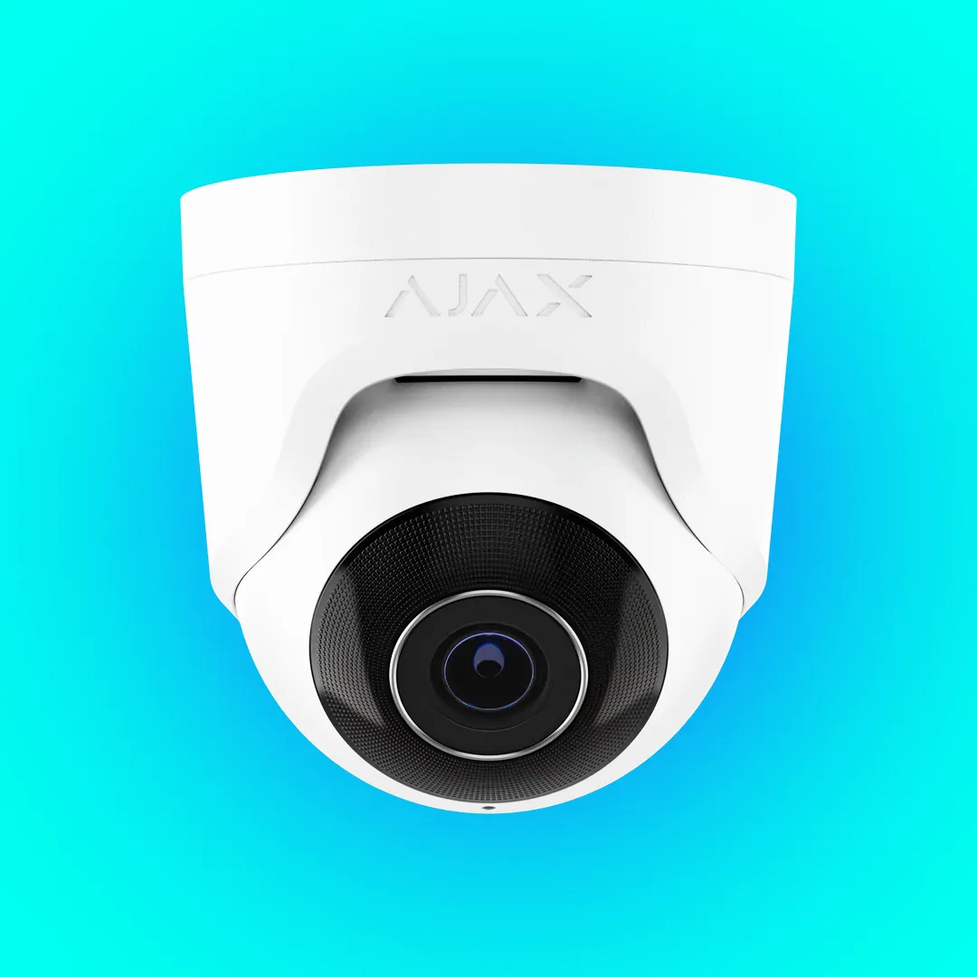 Modern turret camera of the kind sold with AI person and vehicle detection