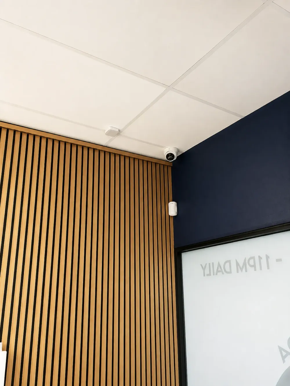 Ceiling-mounted camera recording a commercial interior — every hour of footage lands on the recorder until storage runs out