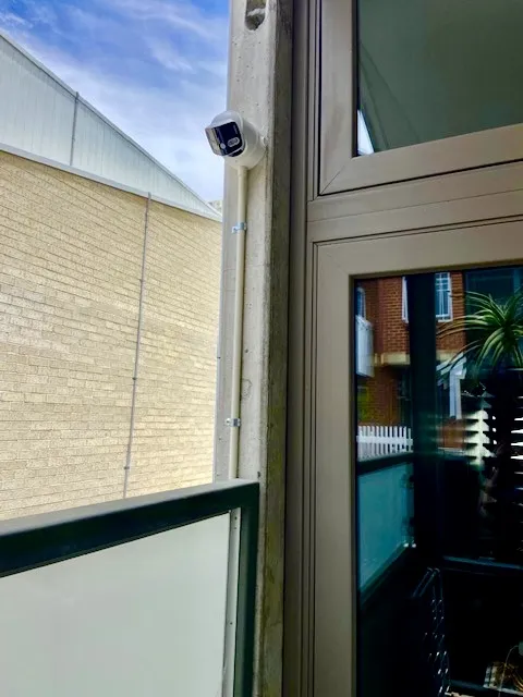 Outdoor CCTV camera installed on a home — the kind of installation people search for rebates on