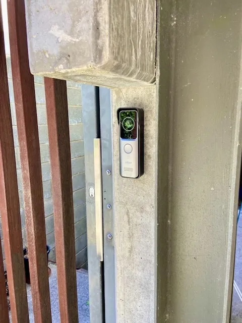 Video doorbell at a secure entry — residents can see and speak to visitors without going to the door